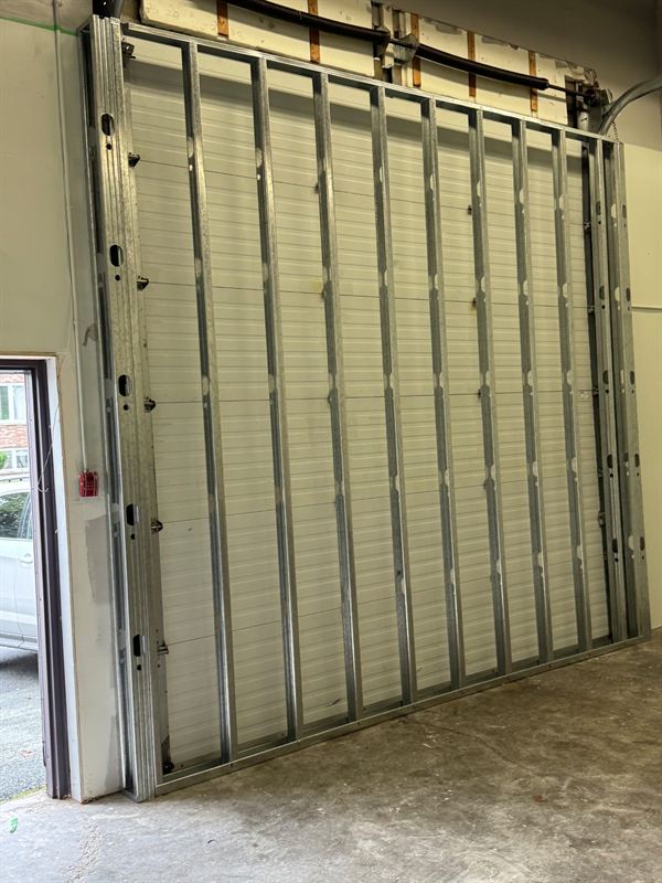 Ceiling grid installed around overhead mechanical piping