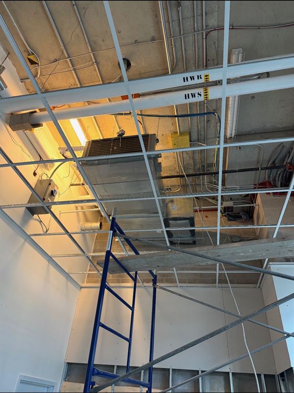 Loading bay opening framed for a new door assembly