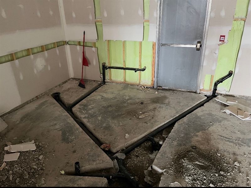 Underslab plumbing rough-in with concrete infill